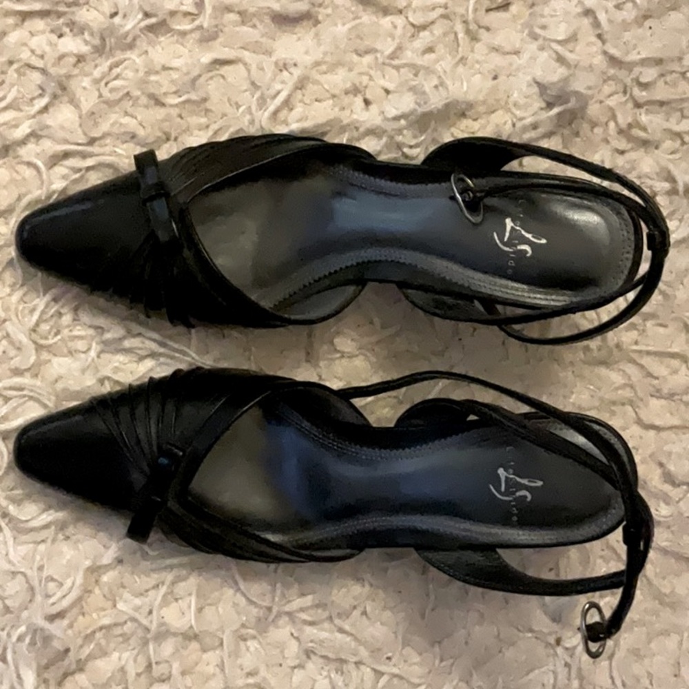 These life stride black heels are size 6and made of foe leather